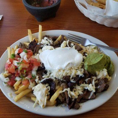 This is what we know as Carne Asada Fries. They are not on the menu but they custom make them for us!  The best!