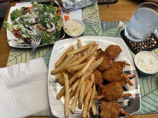 Jumbo fried shrimp, fries, and side salad.