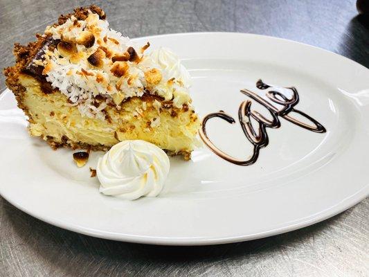 Homemade White Chocolate Cheesecake with a Toasted Coconut Crust