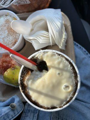 Root beer raspa with lechera (condensed milk on top)