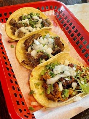 Carne asada, carnitas and Al pastor tacos that my wife ordered. Served with white corn tortillas. Thank goodness!