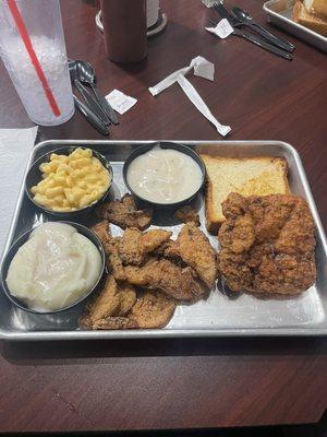 Famous Chicken Fried Steak with white gravy and mashed potatoes, fried squash and Mac and Cheese!