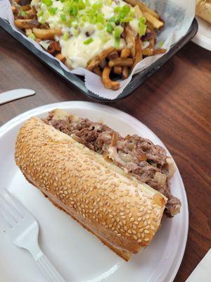 HUGE half  of  my Cheese steak with mushrooms, onions and provolone