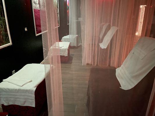 Foot massage area - very dimly lit back room with super wide chairs and soft spa music playing