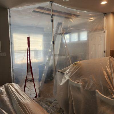 Containment set up and drying process of subfloor, wood framing, and drywall.