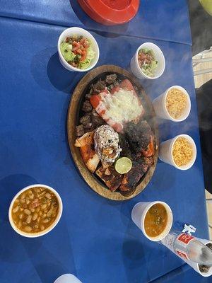 Parillada with the fixings, charro beans, rice, and guacamole