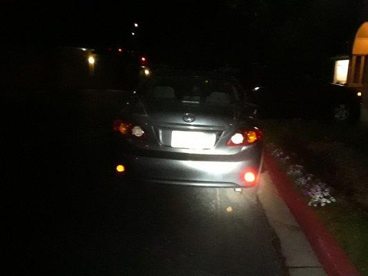 The Maxx Auto Recovery vehicle ironically parked in a fire lane, with a "tow away zone" sign only a few feet away.