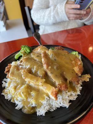 Chicken Katsu Curry Don - Fried chicken with curry sauce and broccoli, carrots, peas, onion served over a bowl of rice.