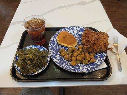 The best Southern meal I have had in many a day: fried chicken, fried okra, collard greens, corn cakes, and mild sweetened iced tea.