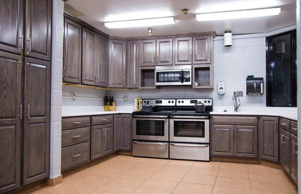 An unusually large kitchen that Kitchen Saver donated to a local firehouse. Cabinets are oak with a driftwood stain.