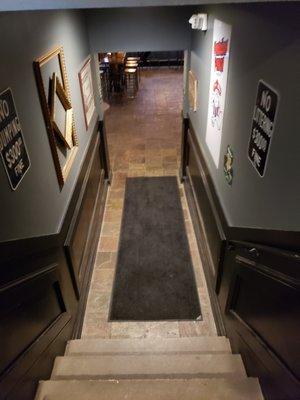 Down the stairs to the bar.