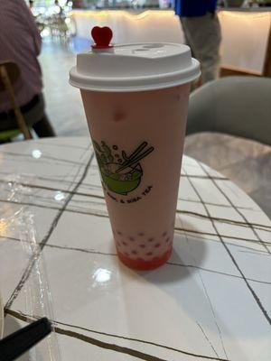 Strawberry milk tea with strawberry popping boba