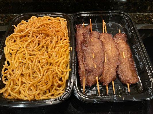 Beef skewers and plain lo mein.