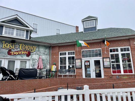 Exterior of Lost Colony Tavern (March 2024) - note the large outdoor / patio seating area weather permitting and in busy season