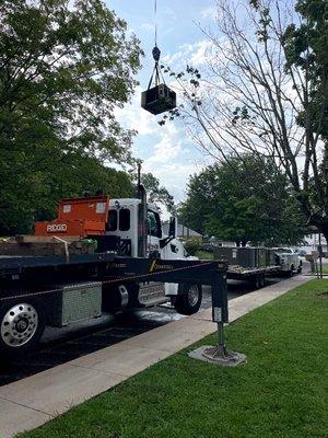 Lifting up a total of four roof top units at a daycare center.