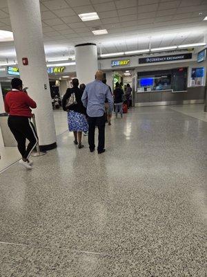 Concourse E. 25+ people in line at 2:30 am. Wouldn't believe it if I didn't see it.