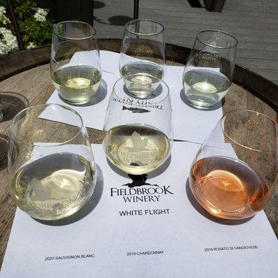 "White flight" tasting. Name is just a little cringe but the wine is good!