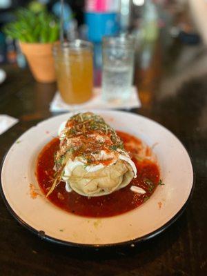 Donkey Tonk - griddled Burrito of Scrambled Eggs, Tater Tots, Avocado, Molcajete, Crema, Fried Leeks, Salsa Roja. Add protein.