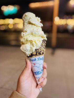 Banana Cream Pie Ice Cream in a chocolate dipped waffle cone with nuts.  SO GOOD.