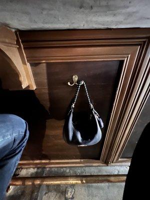 Purse hooks at the bar