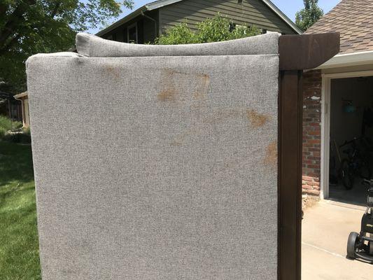 Couch not wrapped, stains on cushions, too, since they were shoved in the top of the trailer (not boxed, wrapped or anything)