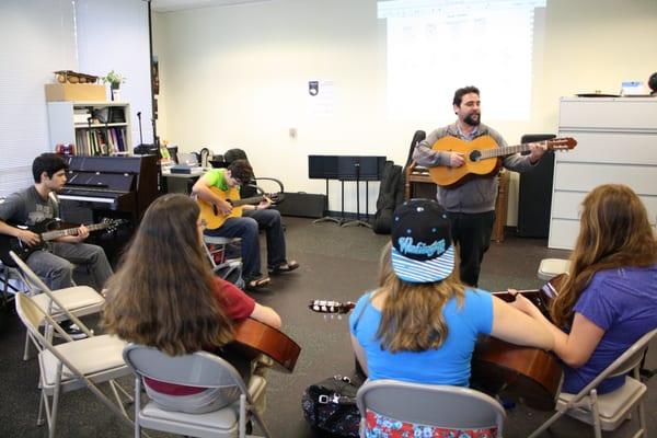 Learning guitar with Mr. Romero.