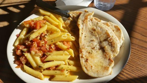 Grilled chicken with penne pasta in olive oil, garlic and bacon. delicious!