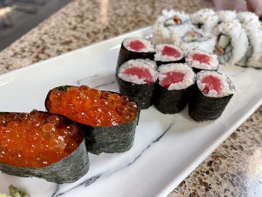 Ikura nigiri, tuna roll, salmon skin roll