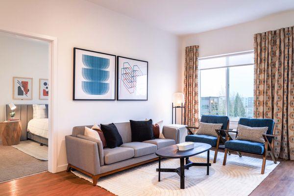 Two bedroom living with gorgeous natural light and expansive window view