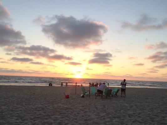 Delivery guy setting up our bonfire!! Beautiful sunset