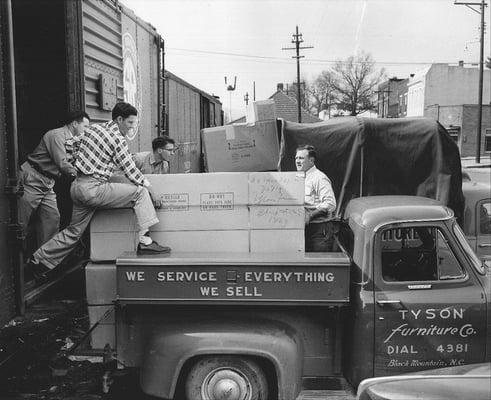 Tyson employees unloading a new railroad delivery of sleeper sofas. Photo from 1956