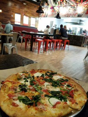 Margherita pizza with spinach. Pretty good and light. Can easily finish the whole pizza.