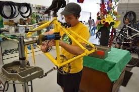 Ken Dahmen (owner) working on a bike.