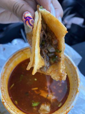 birria taco dipped in consome