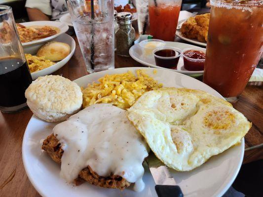 Country fried steak, hash brown casserole, eggs, and a biscuit with a build your own bloody Mary for brunch