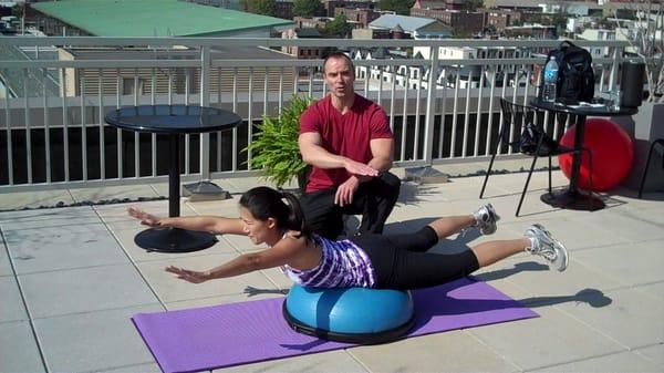 Outdoor workout with client on her building rooftop