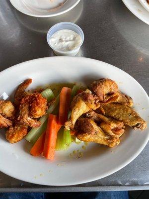 Buffalo shrimp and wings combo.