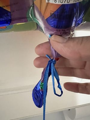 Other store employee tied the string with the balloon that means tie it up properly!