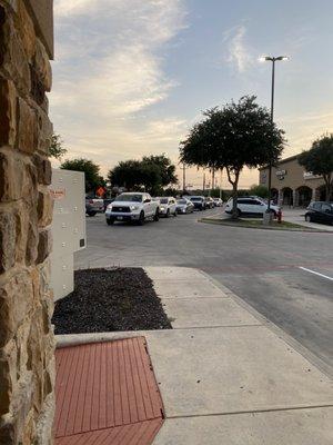 Long line disturbing traffic flow and parking in shopping center