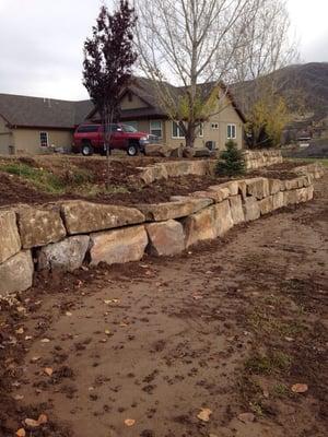 Retaining wall splitting into two tiers.