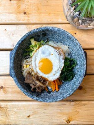 Traditional korean bibimbap with vegetables and a sunny side up egg. Choice of bulgogi beef, chicken and tofu(vegetarian).