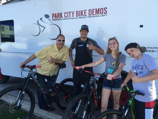 Family with the Park City Bike Demos team, in front of one of the trucks...