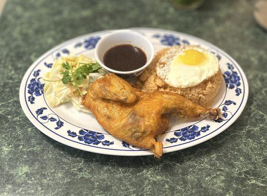 1. CƠM GÀ CHIÊN + Trứng Ốp La: Fried Cornish Game Hen w/Red Rice, Sunny Side Up Egg (Sub.), Pickled Veggies & Special Sauce | $10.95