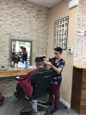 Students train in barber shop setting