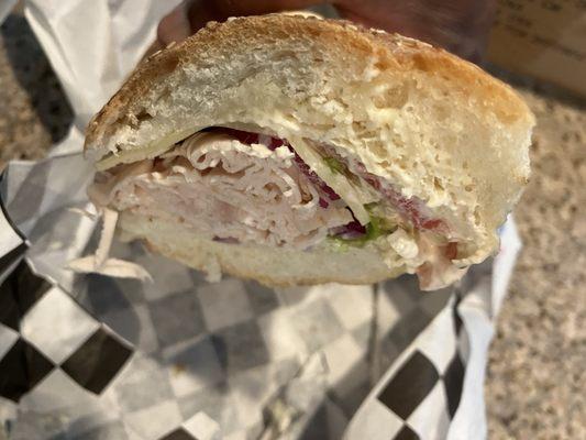 The Turkey and Swiss Hero Sandwich with lettuce, tomatoes, red onions, and extra Mayo. Delicious!