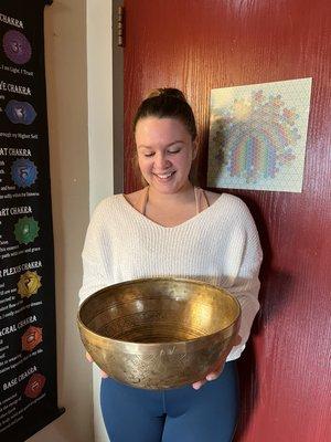 One of our students/client holding one of our singing bowls