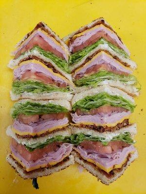 Turkey Club on white bread with lettuce, tomato, bacon, american cheese and mayo!