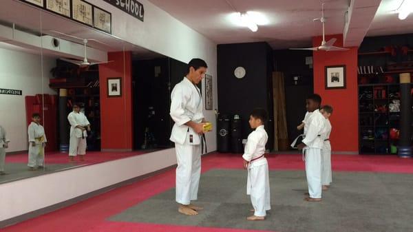 My son receiving his white yellow belt with white stripe after 3 months of work. Thank you sensei!