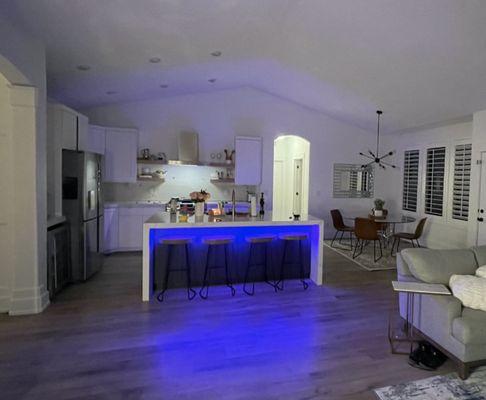 Kitchen remodel with waterfall island and cabinet lighting