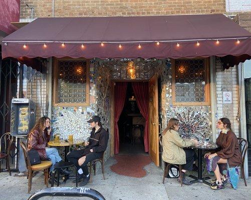 Outdoor sidewalk tables are chess tables.